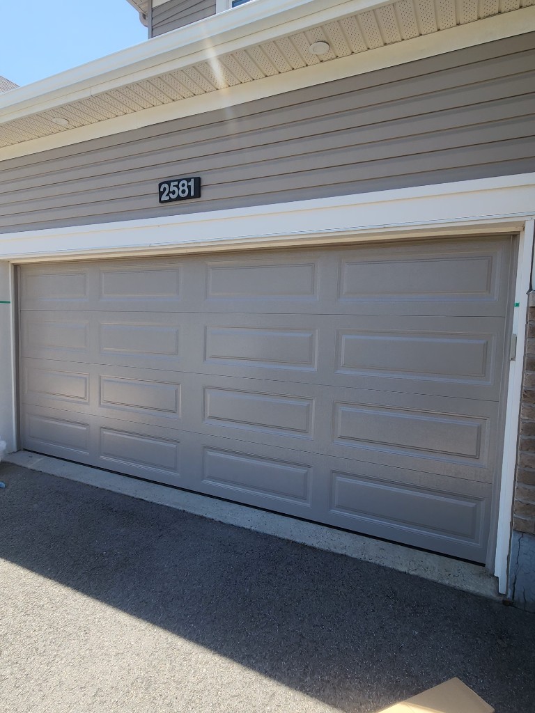 Grey garage door installed in Barrhaven — Ottawa Garage Tech services