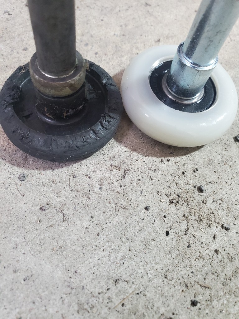 Garage door roller replacement during maintenance Ottawa
